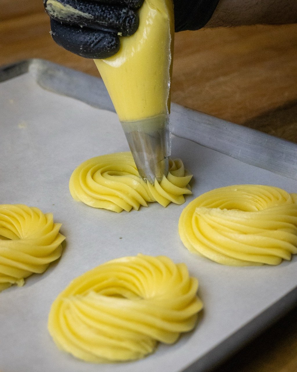 The process of making zeppole pastries.